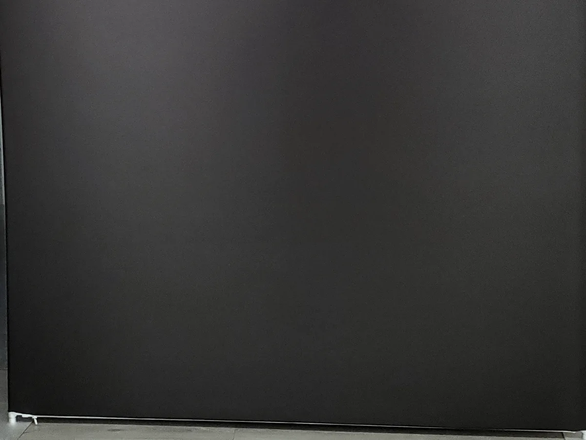Matte black tension-fabric backdrop