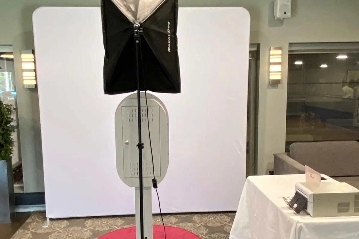 Photo booth and backdrop set up at a corporate venue
